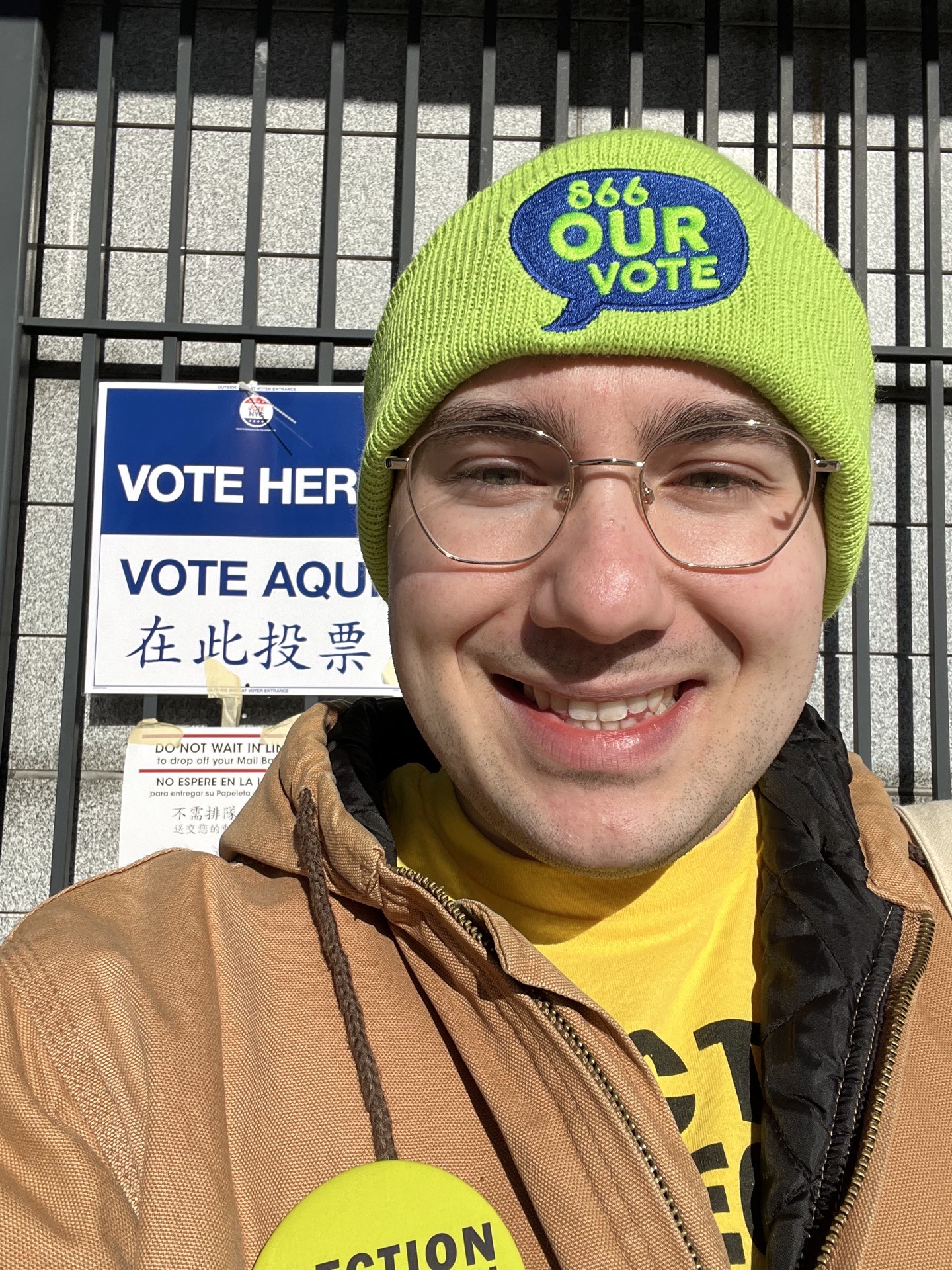 Young volunteer wearing an 866-OUR-VOTE hat at a polling place